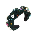 Close-up of green fabric headband with colorful rhinestones and football decorations - Green