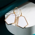 Detail of geometric rhombus earrings with golden frames on a silk background - White Glitter (Z1195) / White