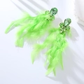 Detailed macro view of fluorescent green feather earrings with crystal gemstones - Green
