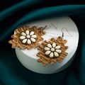 Detailed macro view of vintage leather floral earrings with marble inlay and turquoise - Light Coffee