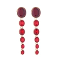 Close-up of long multilayer drop earrings with red crystal stones and gold plating - Red