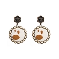 Detail of vintage round boho earrings with cow print pattern and turquoise-like beads - Howlite