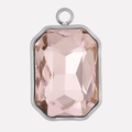 Detail van een roze kristallen hanger met achthoekige snede en zilveren roestvrij staal - Zilveren Rand Roze