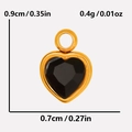 Macro detail of a 0.9cm heart pendant with black faceted stone and golden frame - Gold Black (S2018-G-B)