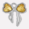 Detailed macro view of bow charm with yellow heart crystals in stainless steel - Yellow Silver Base (S2025-S-Y)