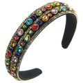 Close-up of baroque headband with colorful glass crystals and golden bead chain - Colorful