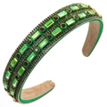 Macro shot of green rhinestone headband with golden bead chain and velvet lining - Green