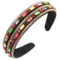Macro shot of colorful rhinestones and crystal details on a luxury velvet headband - Colorful