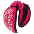 Close-up of fuchsia knotted headband with hand-sewn pearls and sparkling rhinestones - Rose Red