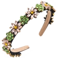 Macro detail showing pink rhinestone petals and green leaves on the floral headband - Green and Pink