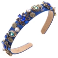 Close-up of royal blue velvet headband with crystal floral and pearl embellishments - Blue