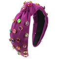 Detail van paarse geknoopte haarband met veelkleurige strass-steentjes en gouden zetting - Paars