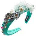 Detailed macro of handmade baroque padded headband with emerald crystals and pearls - Blue