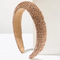 Baroque style champagne gold padded headband with sparkling crystals on white pedestals - Champagne