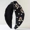 Detail of black satin knotted headband with white pearls and vintage rose badges - Black