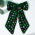 Detail of green velvet Christmas bow with sequins, snowflakes, and mini trees decor - Green