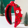 Détail d'un serre-tête de Noël avec Père Noël, sapins et strass multicolores - Rouge