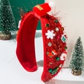 Détail du serre-tête de Noël rouge avec mini bonnet de Père Noël et ornements de fête - Rouge Garance