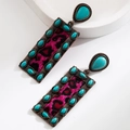 Detail view of retro bronze earrings with turquoise stones and fuchsia leopard faux fur - Rectangular Rose Red Leopard Style