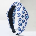 Detailed view of the Evil Eye patterned fabric headband with a stylish top knot design - Single Eye Pattern