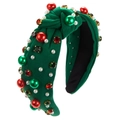 Detailed macro shot of green velvet Christmas headband with pearls and rhinestones - Green
