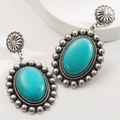 Macro di orecchini vintage in argento con pietre turchesi e dettagli radiali intagliati - Verde