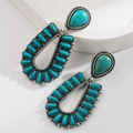 Detail of silver-finish bohemian earrings with turquoise stones and twisted rope textures - Turquoise Teardrop