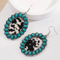 Vintage bohemian turquoise leather earrings with western cow print pattern and hooks - Black and White Oval