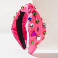 Diadema anudada rosa fucsia con cristales de colores sobre un fondo blanco puro - Rosa Rojo