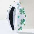 Detalle de diadema anudada blanca con piedras turquesas y engastes dorados - Blanco