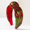 Close-up of red and green sequin Christmas headband featuring a stylish top knot detail - Red Green Stripes
