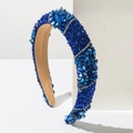 Détail macro du serre-tête bleu avec textures de pierres et bandes de strass parallèles - Bleu