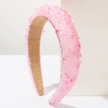 Close-up of pink baroque headband featuring crystal beads and thick sponge padding - Pink