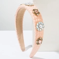Dettaglio cerchietto imbottito rosa con perle e decorazioni in cristallo floreale - Arancione