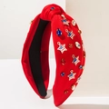 Dettaglio fascia rossa annodata con strass colorati e ciondoli a stella bandiera USA - Rosso