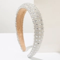 Detail of wide sparkling headband with clear rhinestones and beige suede lining - White