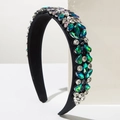 Detailed view of luxury baroque headband with handcrafted colorful crystals on velvet base - Green