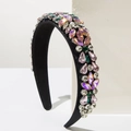 Detailed macro of Baroque fabric headband with colorful hand-set rhinestones and crystals - Pink