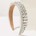 Detailed macro view of silver baroque headband featuring triple row crystal rhinestones - White