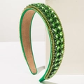 Baroque green crystal headband with emerald rhinestones and golden chain detail on white block - Green