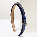 Detailed side view of baroque velvet headband with blue rhinestones and gold butterflies - Blue