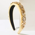 Detail of baroque cream sponge headband featuring intricate golden rhinestone floral patterns - Brown