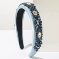 Close-up of light blue satin headband with intricate blue crystal and rhinestone clusters - Blue