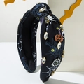 Cerchietto per Halloween con stampe ragnatela, decoro zucca e strass luccicanti - Nero