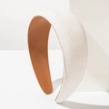 Detail of white canvas headband with brown leather lining and neat stitching texture - White