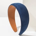 Detailed side view of a padded velvet headband with navy suede and brown leather lining - Blue