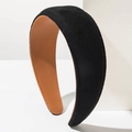 Close-up of black twill fabric velvet headband with orange stitching and brown leather lining - Black