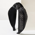 Macro detail of black satin headband with top knot design and sparkling rhinestone accents - Black