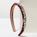 Detail view of burgundy velvet headband with colorful gems, pearls and pink silk bows - Red Pink