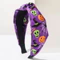 Halloween Knoten Stirnband mit lila Stoff, grünen Totenköpfen und orangefarbenen Kürbissen - Lila